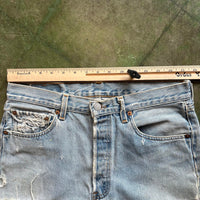 Vintage Levi's 501 Jeans Straight Leg Faded and Distressed Made in USA 31x34